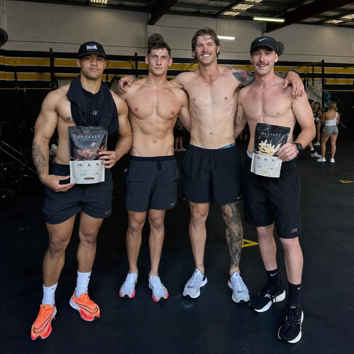 A group of people holding OLEVATE pouches